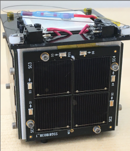 A close-up photo of a pocketqube nanosatellite